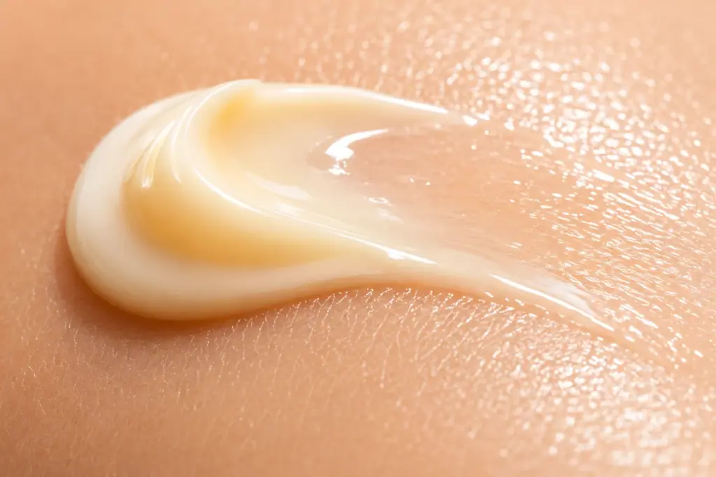 Botanical Renewal: Why Phyto-Retinol and Ceramide Complex Is the Ultimate Nighttime Protocol for Compromised Skin 3 Macro photograph of a rich dollop of Phyto-Retinol and Ceramide Complex cream melting smoothly into sensitive skin to restore the lipid matrix.